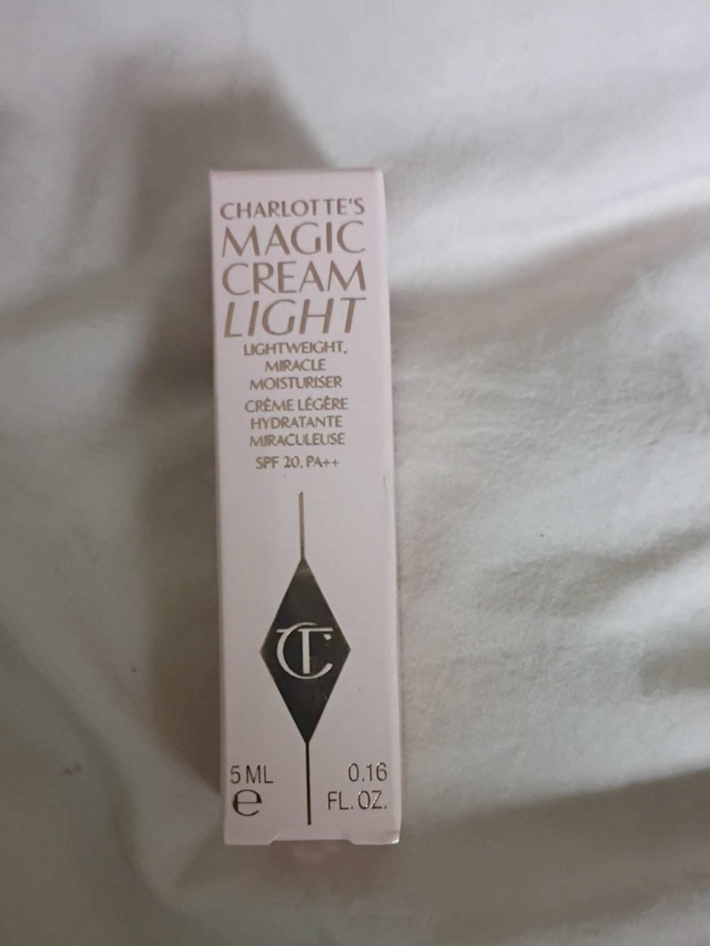 Charlotte Tilbury Magic Cream Light Moisturiser - Pale Pink & Gold Text